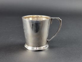 A silver Christening mug, by Ernest W Haywood, Birmingham 1946, 7.5cm high, 110g.