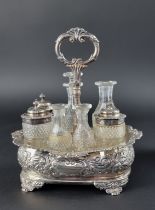 A George IV silver cruet stand, with seven cut glass bottles, London 1823, 24cm high.