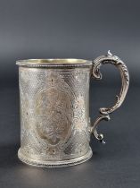 A Victorian silver mug, by Edward & John Barnard, London 1861, having engine turned and chased