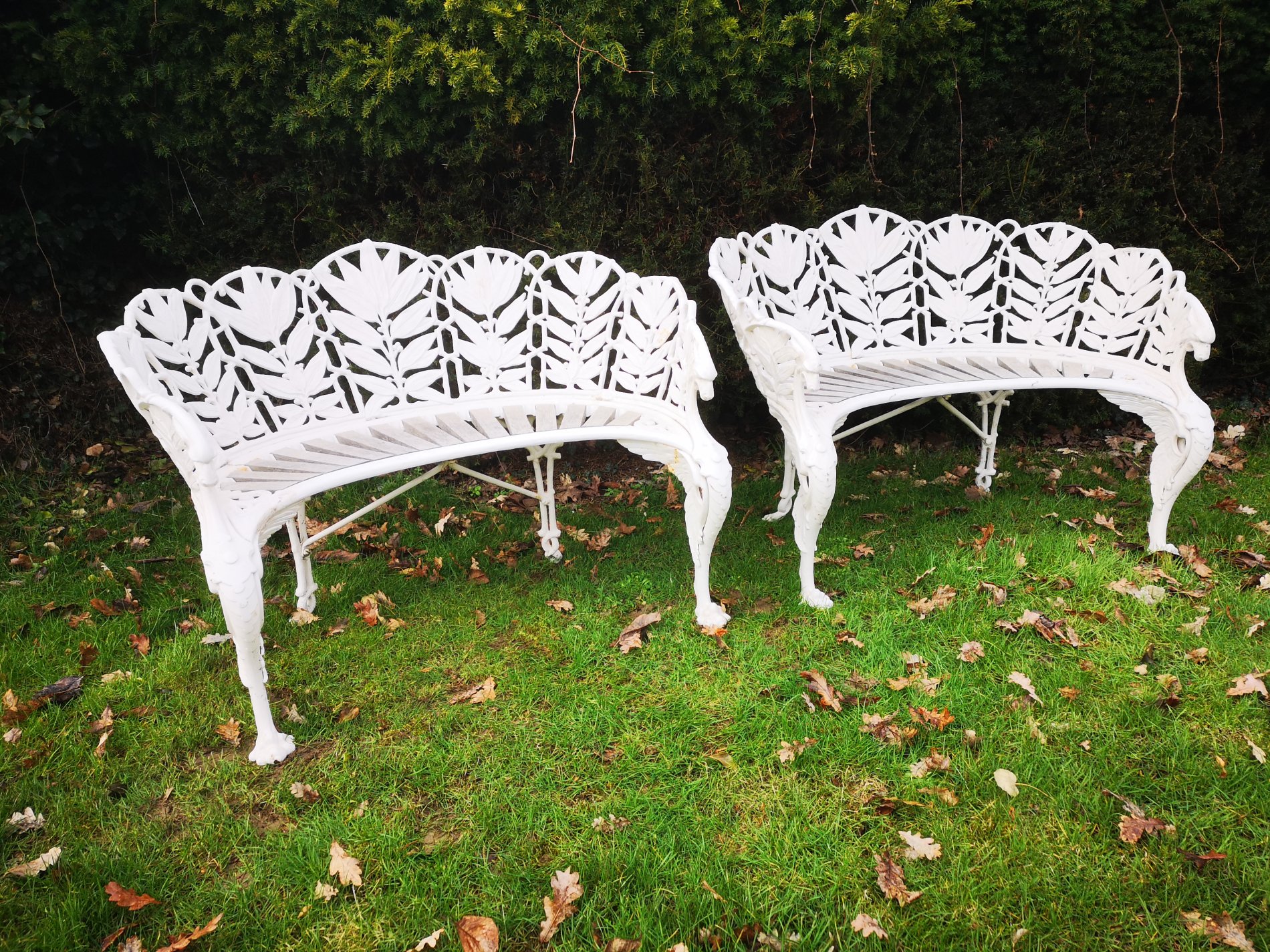 A rare pair of Coalbrookdale Laurel pattern cast iron seats