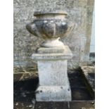 A pair of rare Austin and Seeley composition stone urns