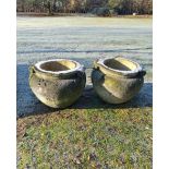 A similar slightly smaller pair of carved Cotswold limestone scroll pots