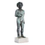 A bronze figure of a putto