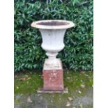 A Victorian cast iron urn