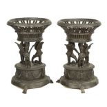 A pair of bronze Pompeian style jardiniere stands