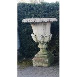 A composition stone urn - pedestal