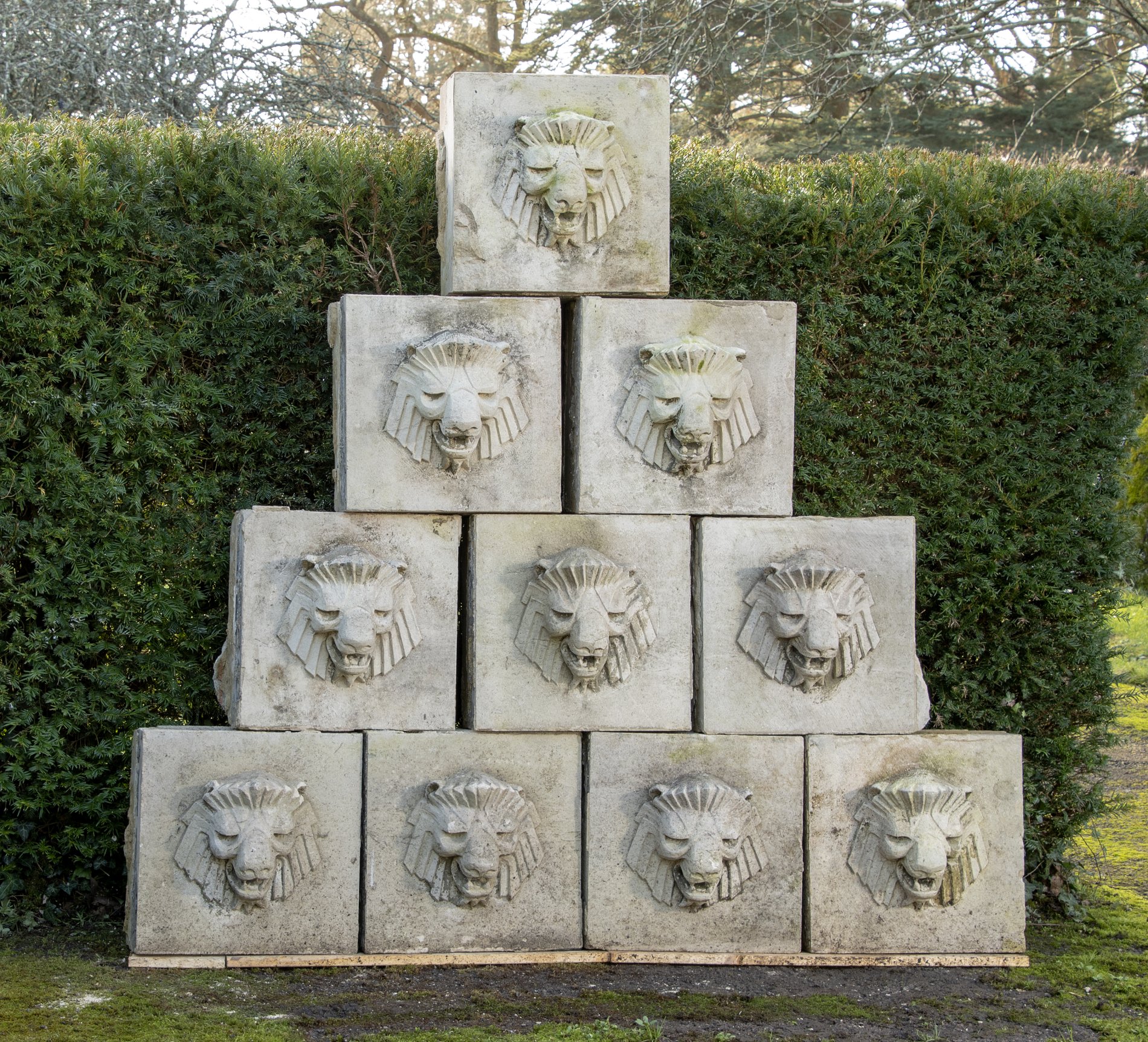 A pair of Art Deco carved Portland stone plaques