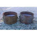 A pair of cast iron planters