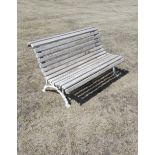 A cast iron and wooden slatted seat