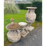 A pair of Swedish style composition stone lidded urns