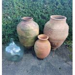 Three terracotta oil storage jars