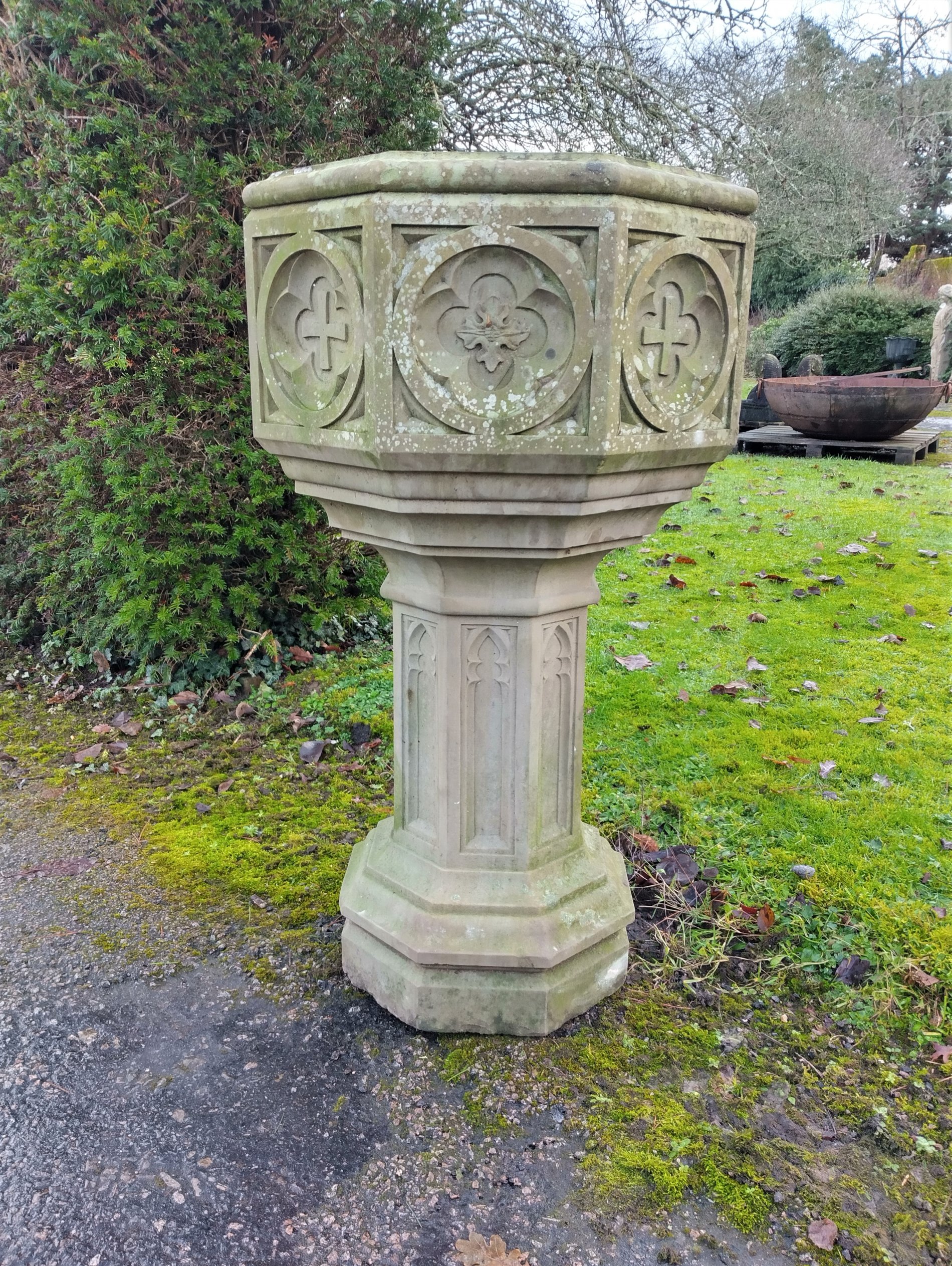 A Victorian carved stone font