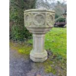 A Victorian carved stone font