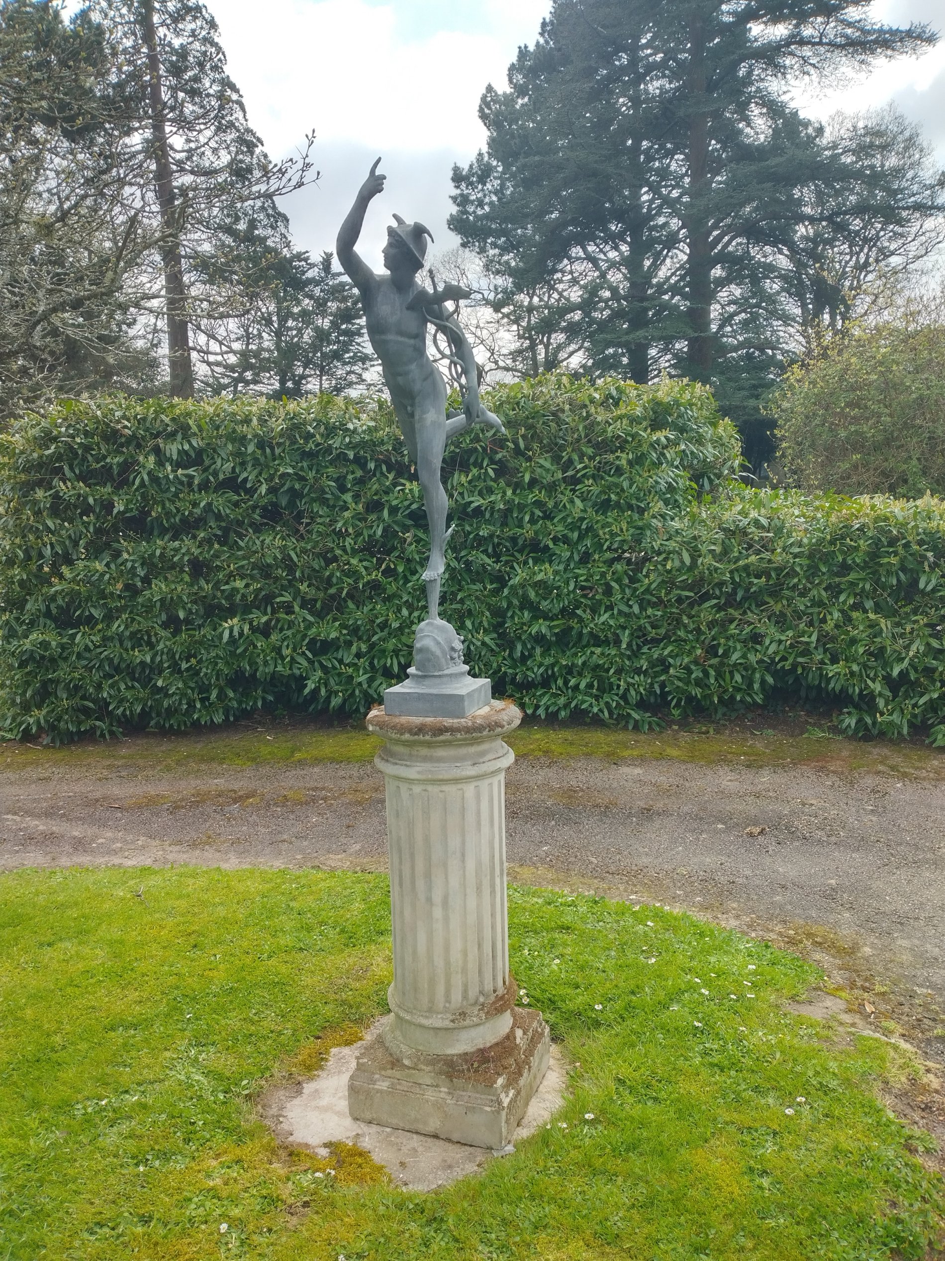 A lead figure of Mercury on pedestal