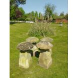 A set of four similar staddlestones