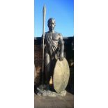 A similar impressive and colossal patinated fibreglass figure of a Zulu warrior