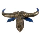 A similar gilded and carved hardwood buffalo head