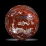 A large red jasper sphere