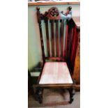 Pair of antique high backed dark wood chairs.