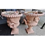X2 Cast iron urns plus x2 small pot urns