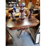 Antique regency tea table with sabre legs