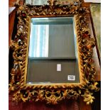 Antique gilt Italian style highly carved wall mirror 65cm x 50cm