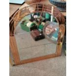 Arched retro wall mirror with copper effect surround