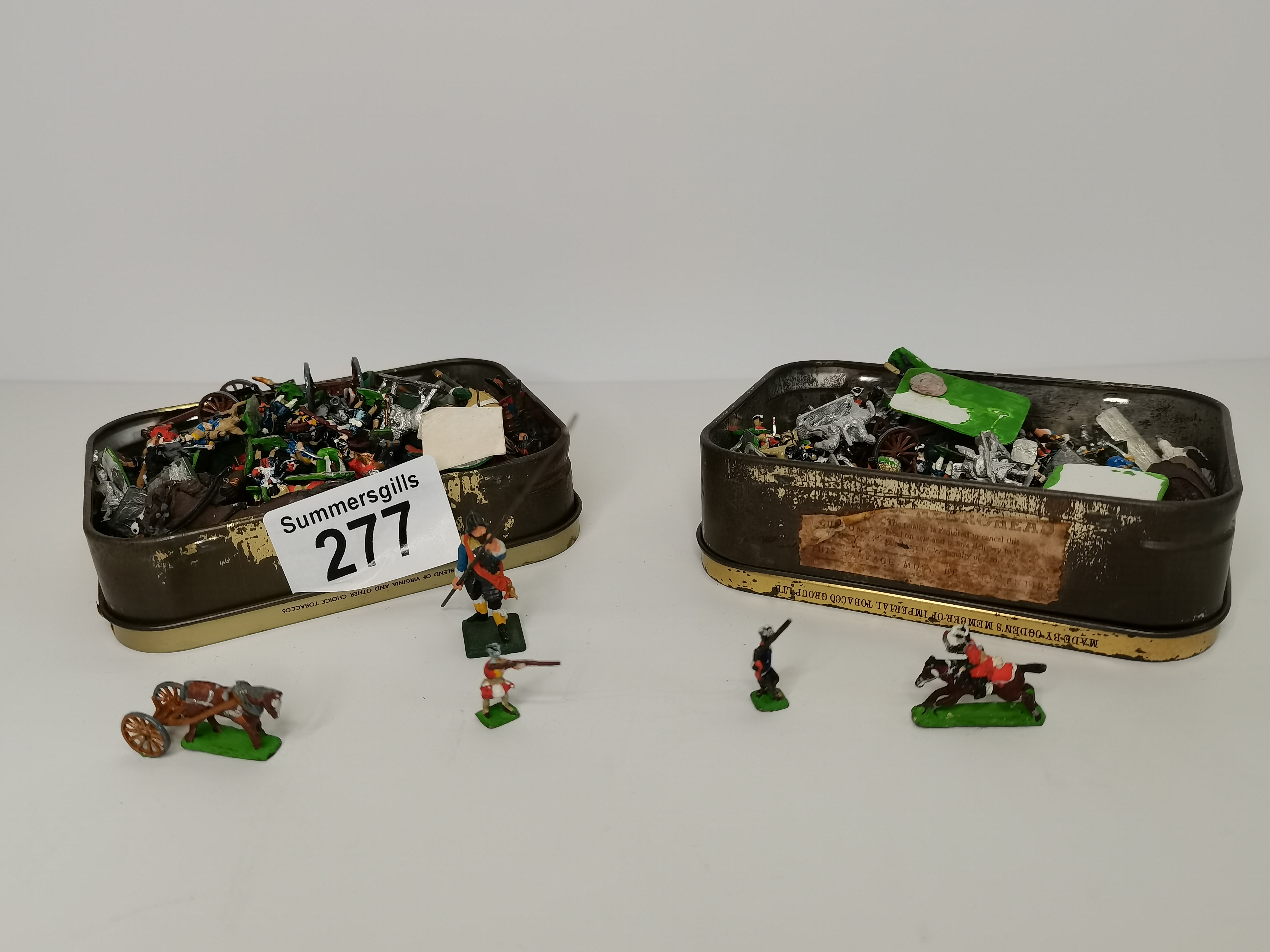 x2 tins of lead soldiers, horses, cannons etc