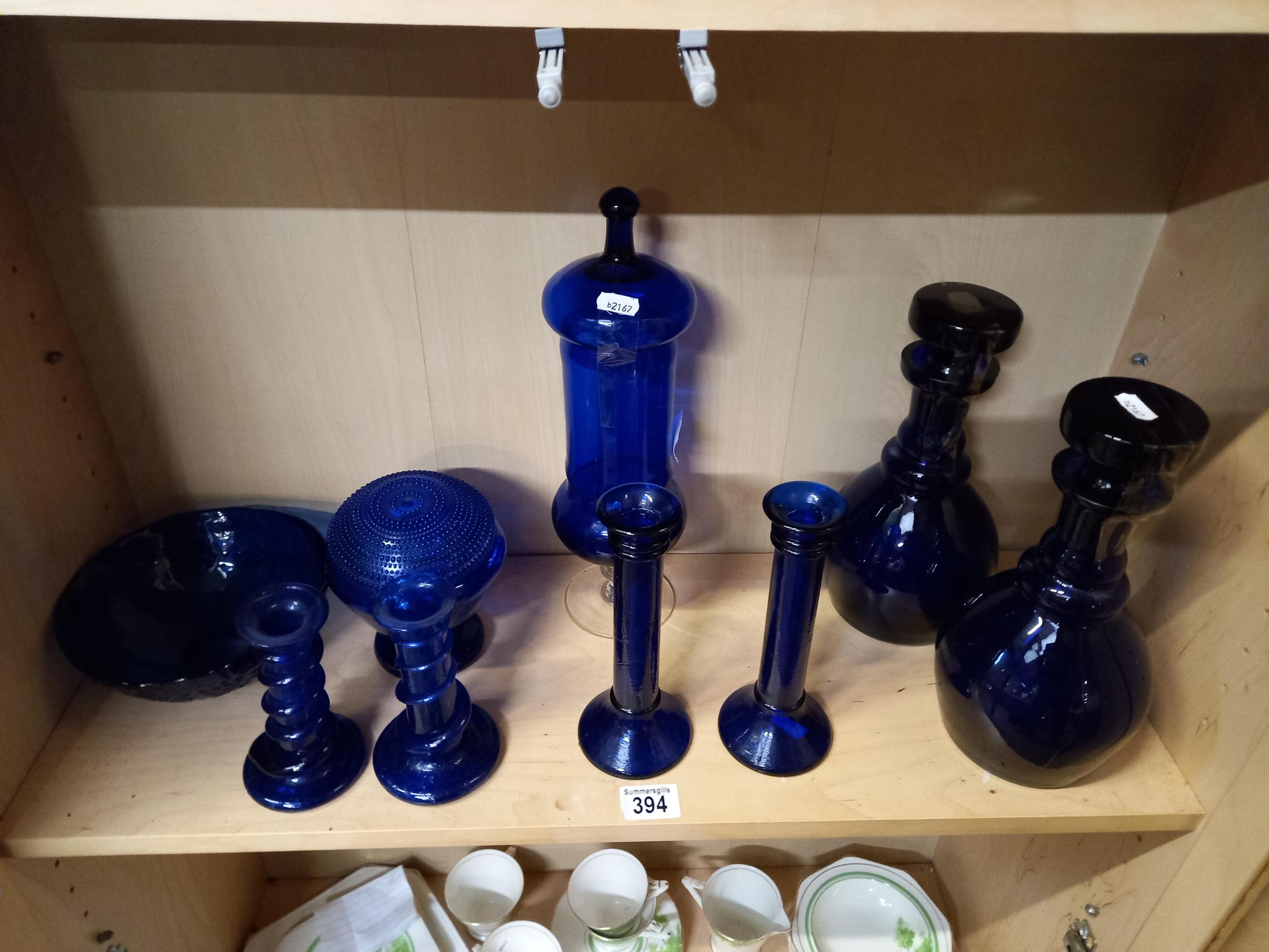 Blue coloured glass items incl decanters and candl