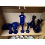 Blue coloured glass items incl decanters and candl