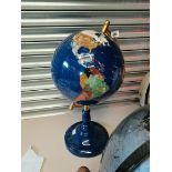 Gemstone globe on blue stand