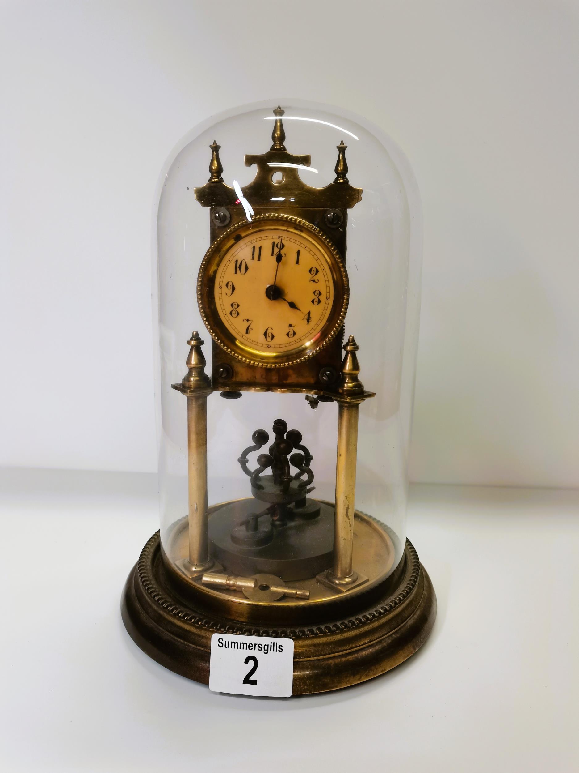 Brass glass dome skeleton clock with key - Image 2 of 4