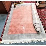 2 x large pink and pale green chinese rugs