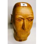 Carved wooden head