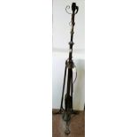Antique metal standard lamp with flame decoration