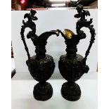 A pair of Antique Bronze cherub urns