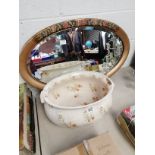 Ornate oval mirror and ironware foot bath