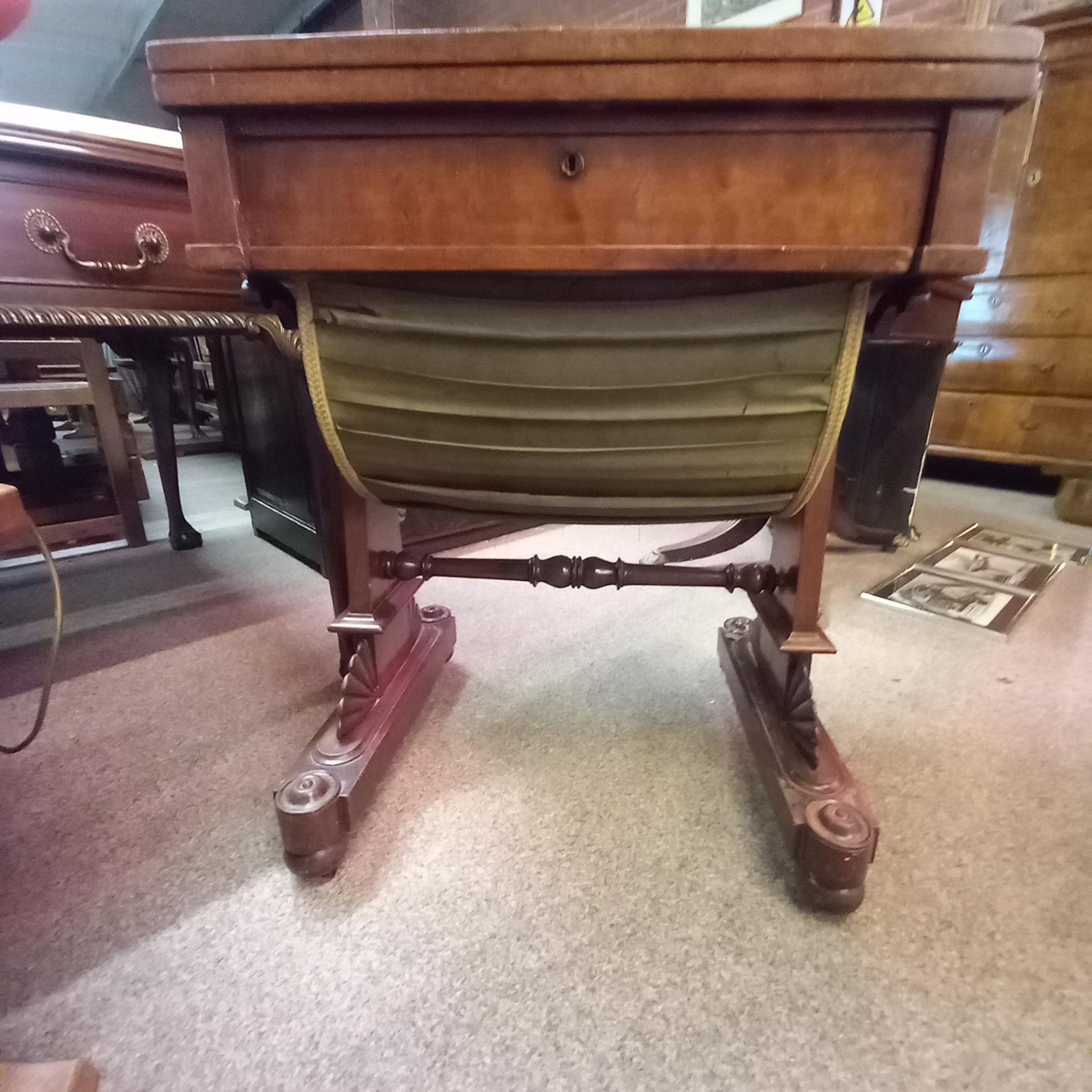 Antique mahogany sewing table with highly decorative carved decoration