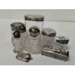 A collection of cut glass and Silver perfume bottles