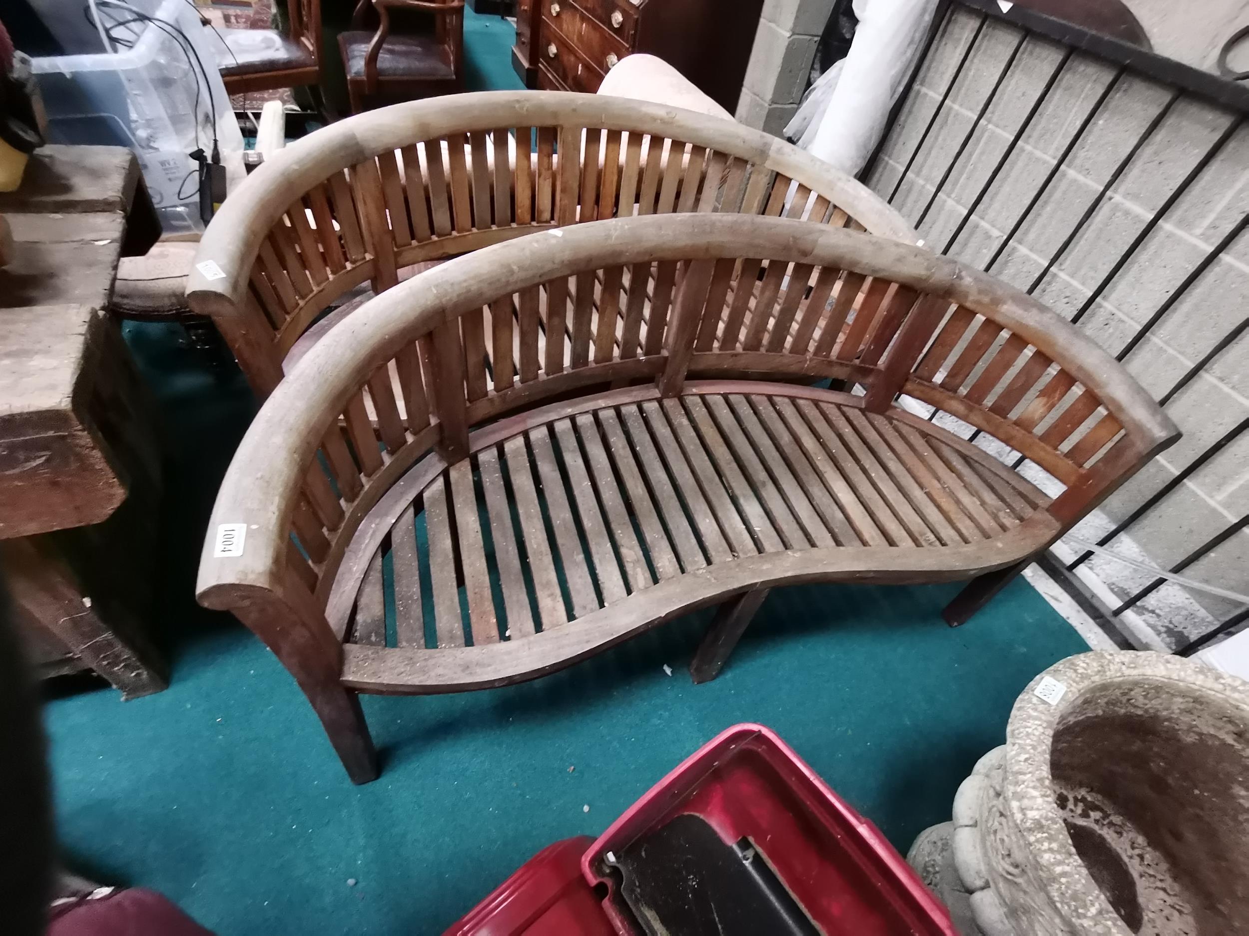 Teak garden bench with curved seat