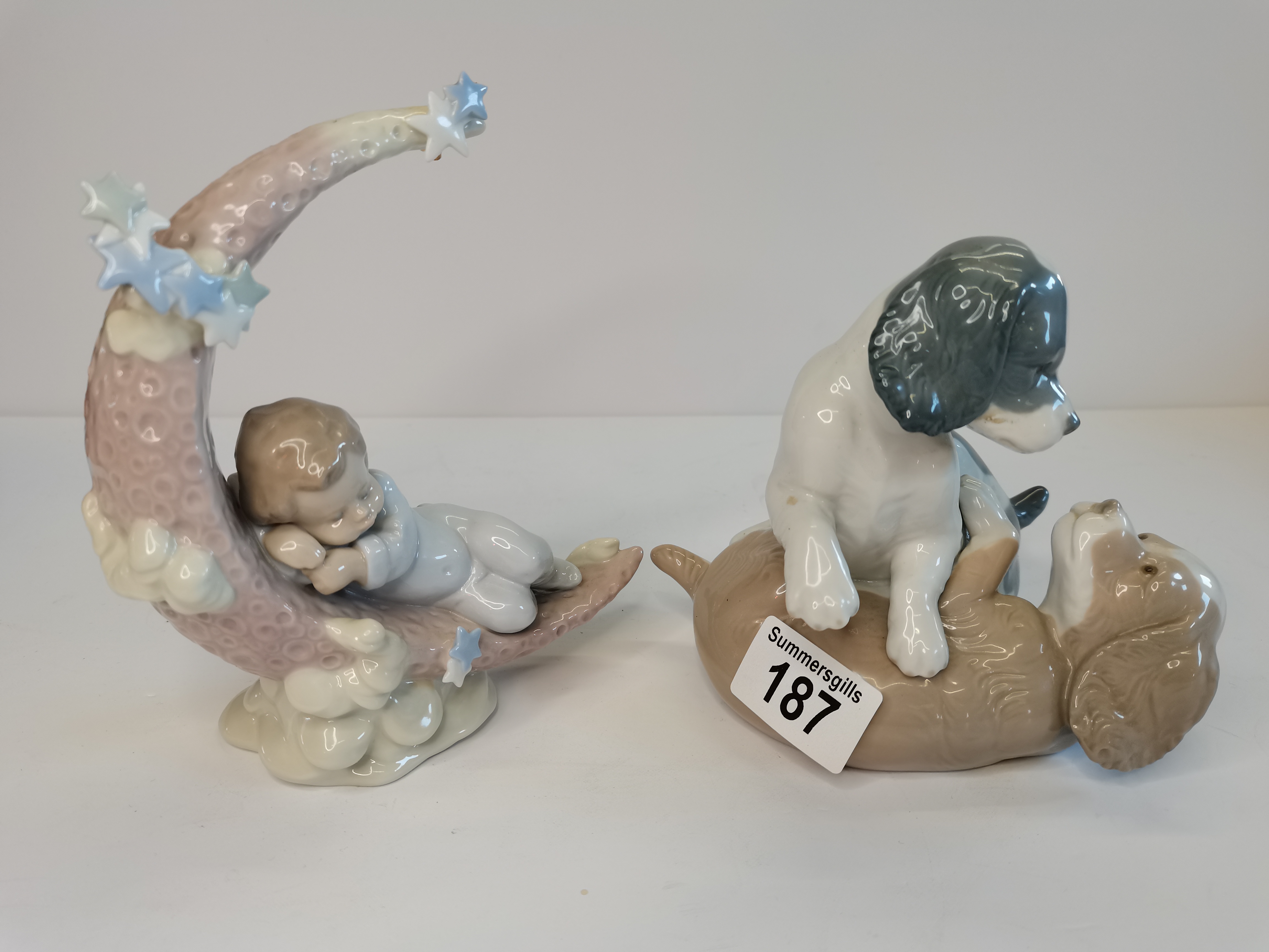 Nao Figurine 'Playful Puppy Dogs' and A Lladro figurine 'Heavenly Slumber'