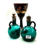 A Pair of Regency green bottles with stoppers and a large red glass goblet
