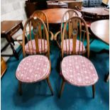 Round Ercol dining table and 4 high backed swan chairs