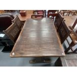 Draw leaf carved oak dining table and 4 leather seated chairs