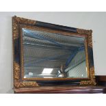 Black and gilt edged wall mirror