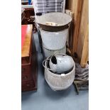 A collection of metal watering cans and dolly cans plus hay spade