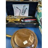 Saxophone in Case and a Copper Bed Pan