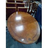 Oval Walnut table on castors