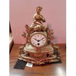 Antique gilt mantle clock with cherub decoration