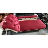 Red velvet covered Chaise longue on casters